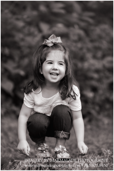 A photo of a little sister during a family-sibling session
