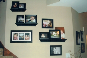 A client provided photo of their wall display filled with Marmalade Photography photos