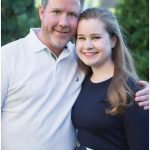 An outdoor portrait of a father and his daughter at home in Lincolnwood