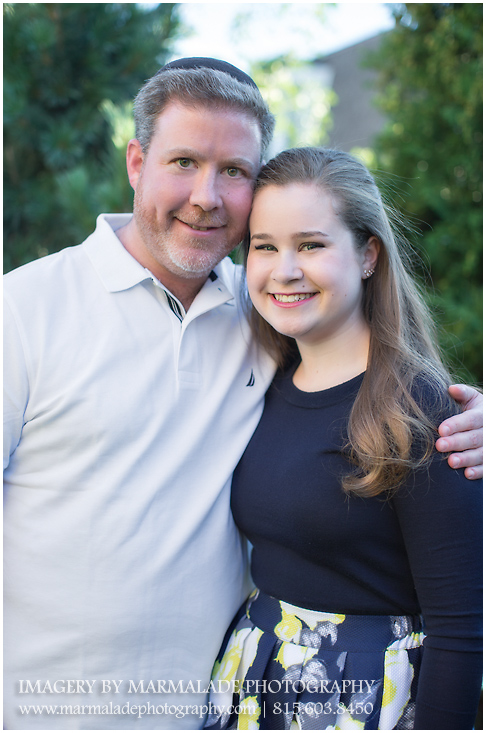 An outdoor portrait of a father and his daughter at home in Lincolnwood