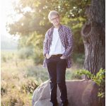 A photo of a boy in a natural outdoor setting