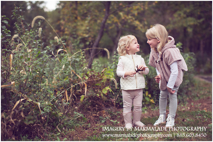 An example of a photograph of young sisters in the fall