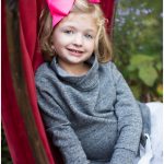 A photo of a preschool aged girl in a natural outdoor setting