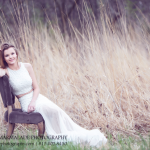 a photo of a young lady in her prom dress in tall grasses in the joliet illinois area