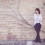 Nequa Valley High School Senior photographed on a rustic stone wall