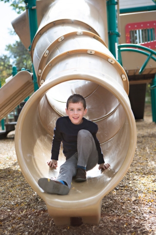 Photo of a boy at a playground in suburban LaGrange, Illinois