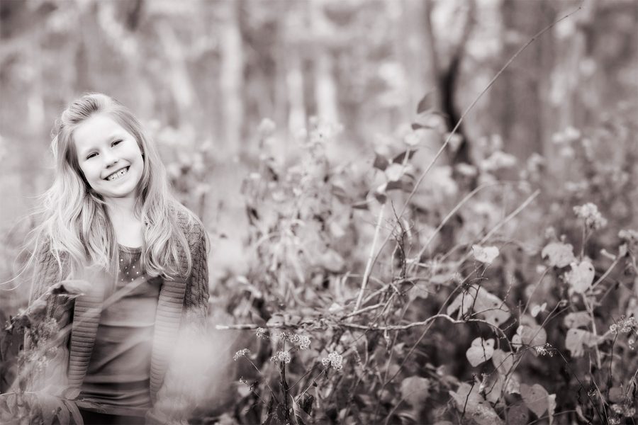 Photo of a Minooka area child in a wooded field in the fall